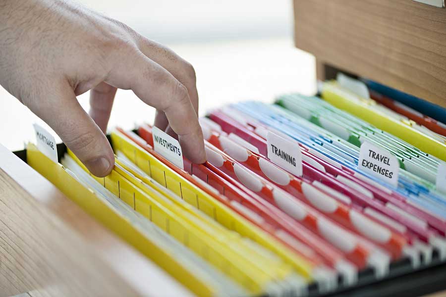 bigstock-Hands-searching-through-file-f-62070185-smaller